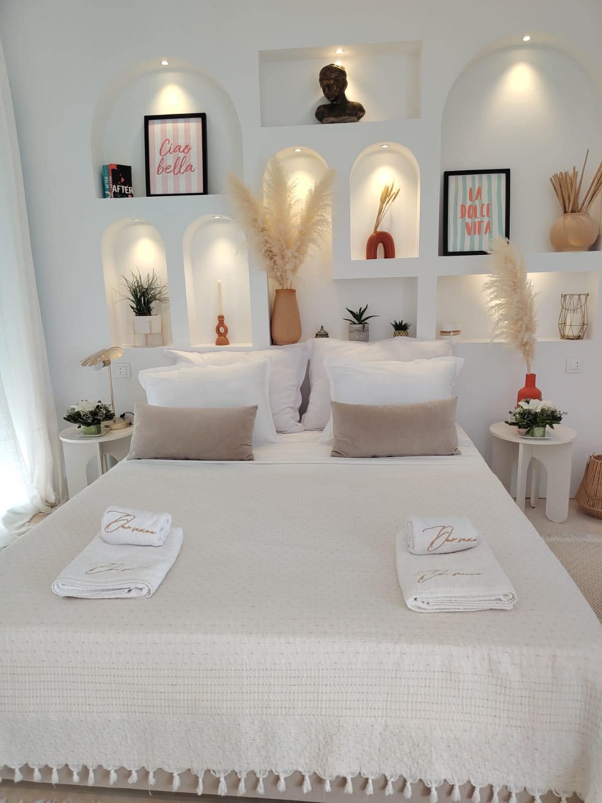 Boho-styled bedroom with decorative wall niches