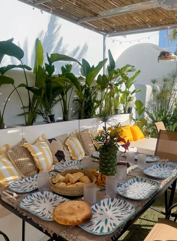 Breakfast prepared on a shaded patio