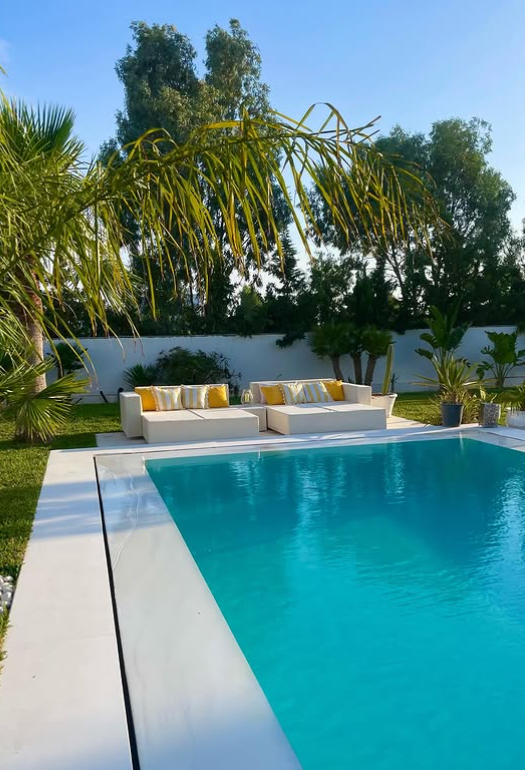 Private pool surrounded by palms at Dar Sanou